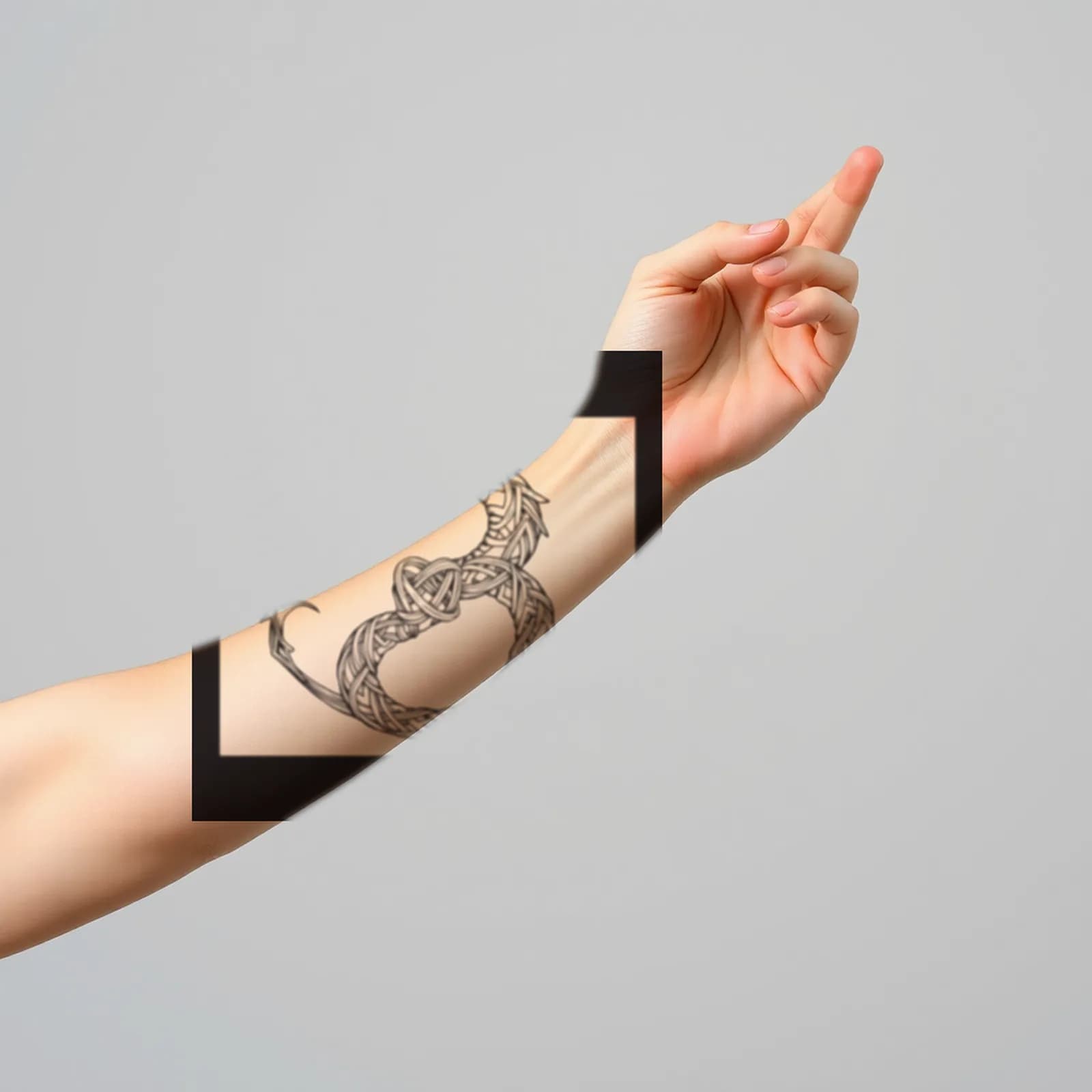 Celtic Knotwork Dragon tattoo shown on the forearm