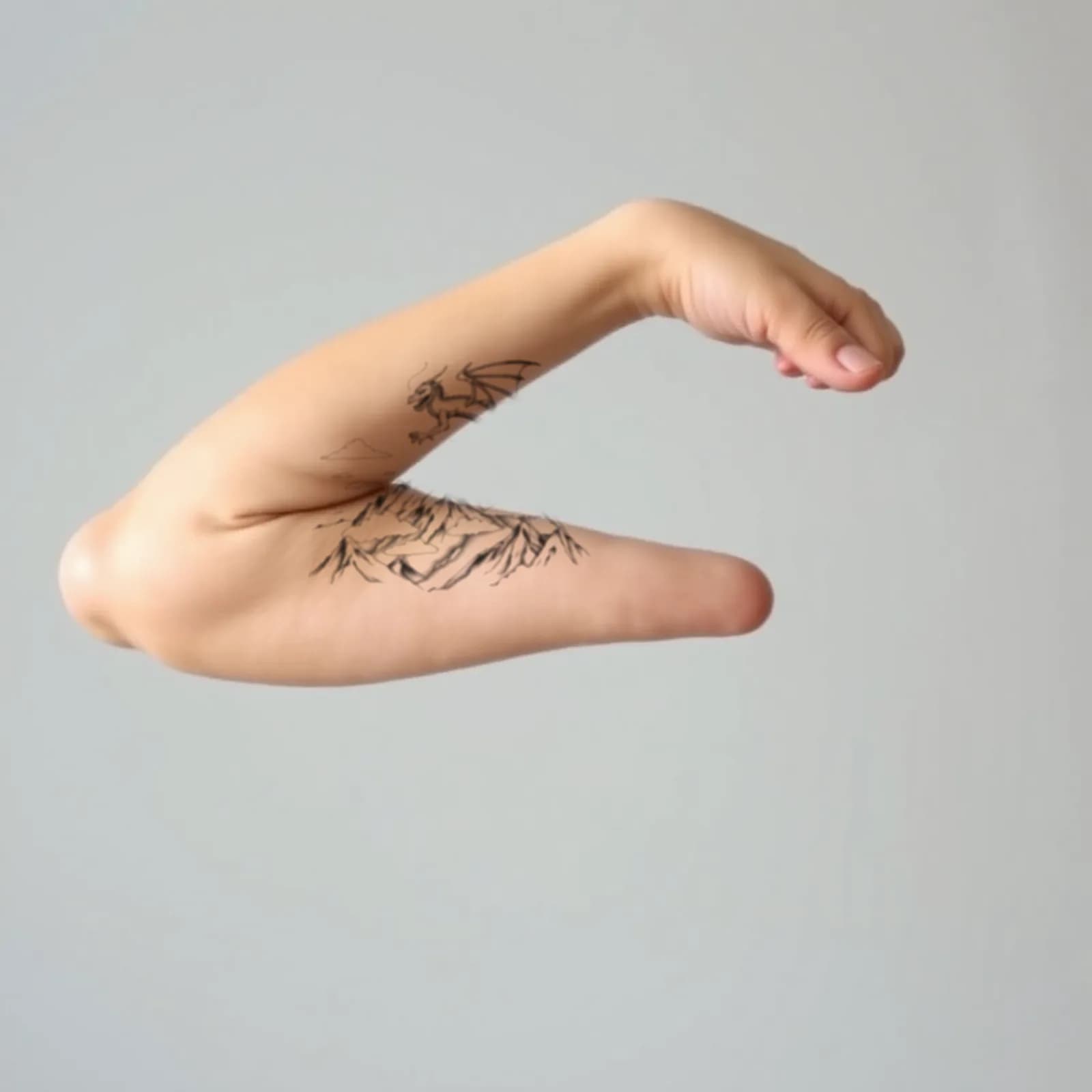 Dragon over Mountain Landscape tattoo shown on the upper arm